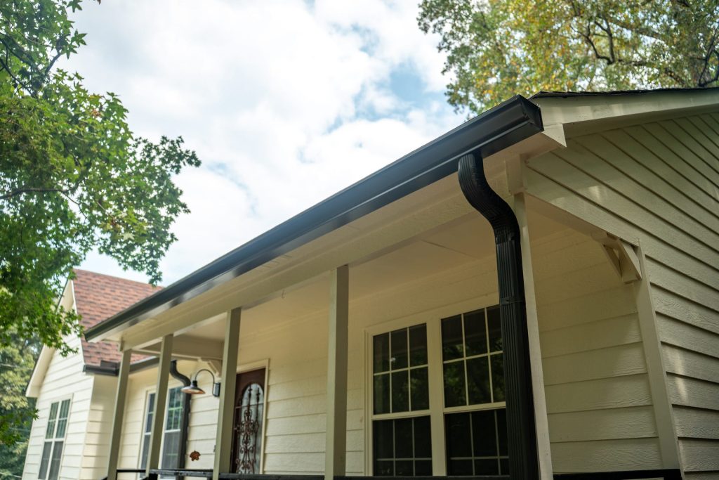 Black gutters on a cream-colored home