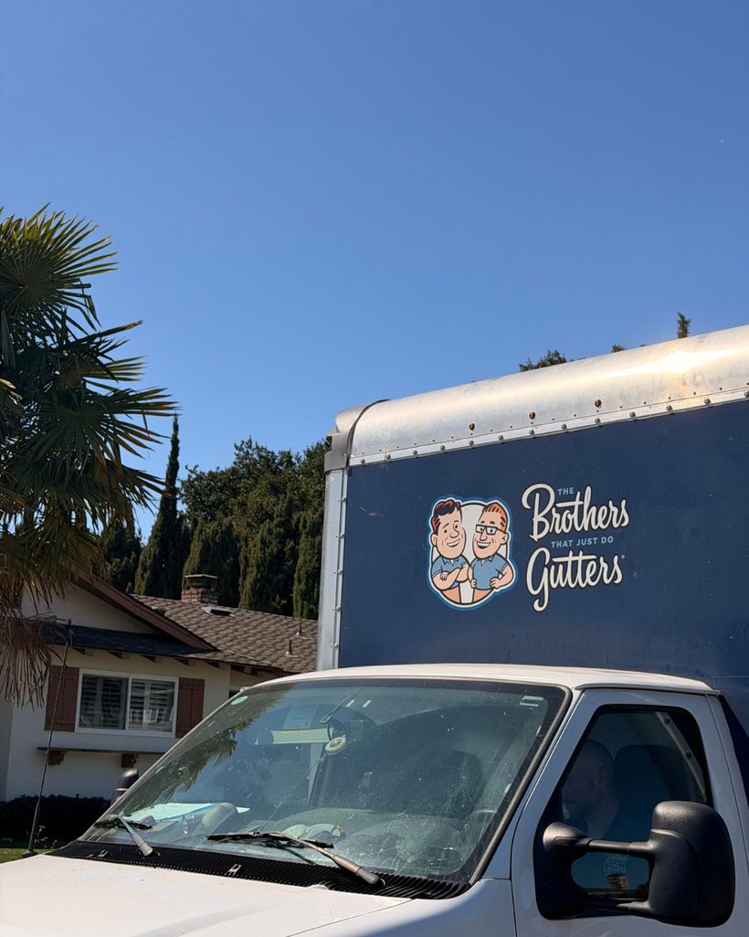 The Brothers Gutters truck parked at a job