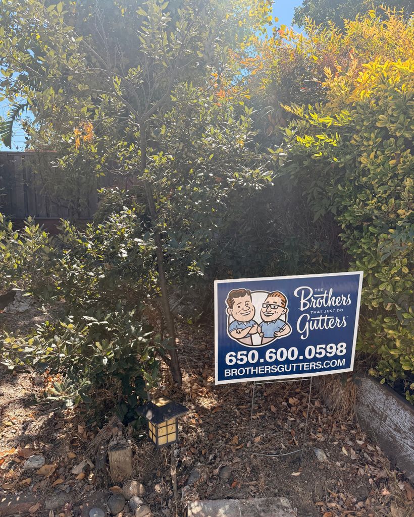 Yard sign out front after the install