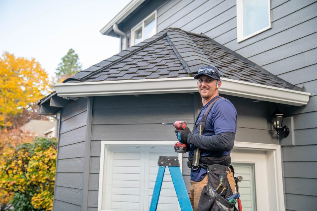Finishing a new gutter run over a garage