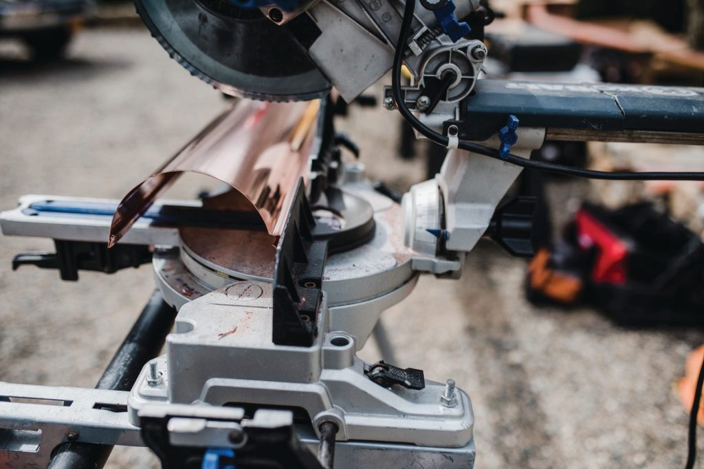 Cutting a gutter miter on the saw