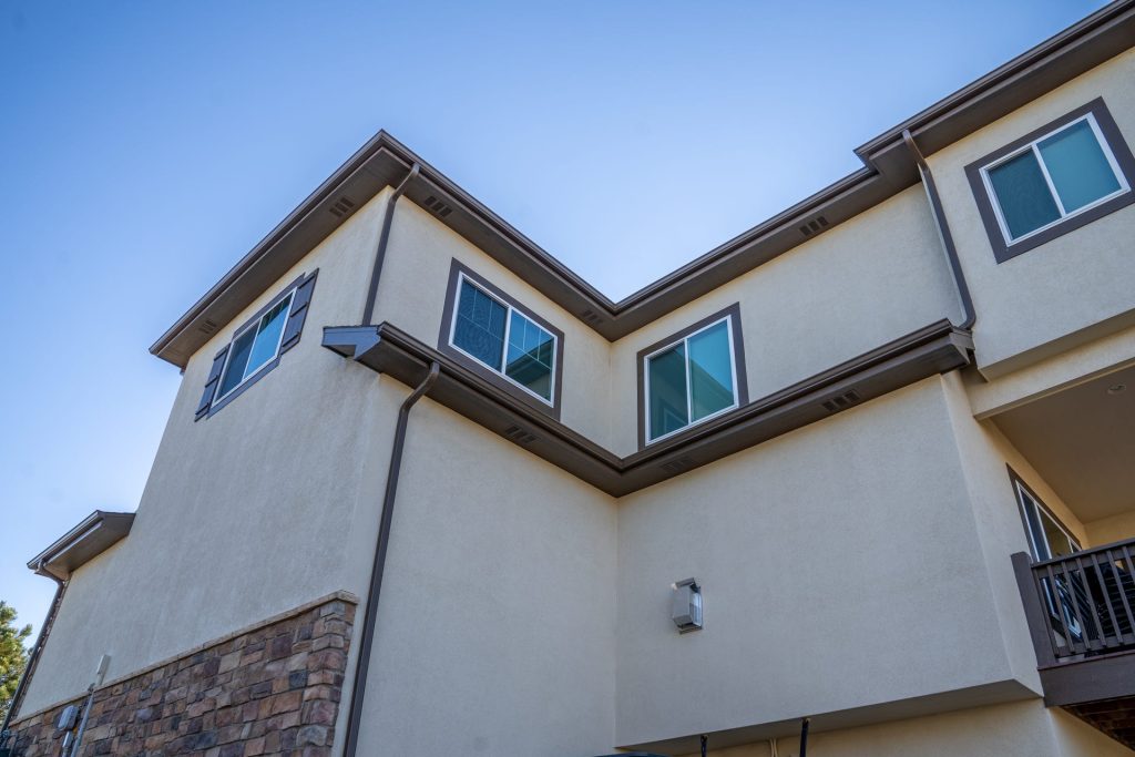 Gutters on a modern two-story stucco home