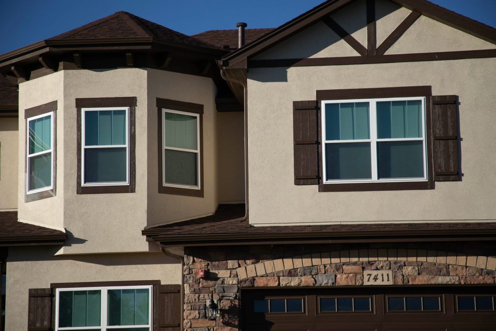 Gutters over a stucco bay window