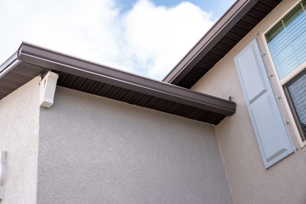 Dark gutters following a stucco gable