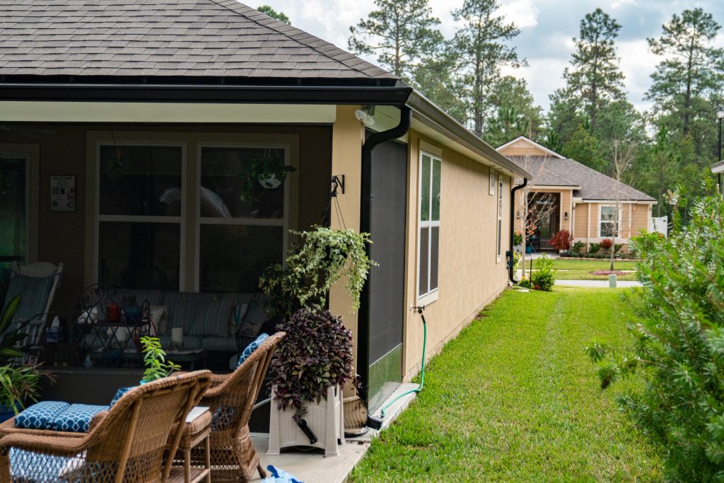 Black gutters on a stucco home