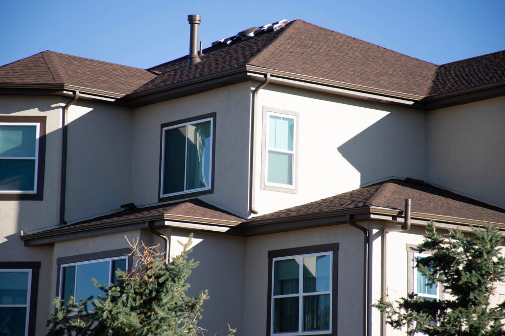 Seamless gutters on a two-story stucco home